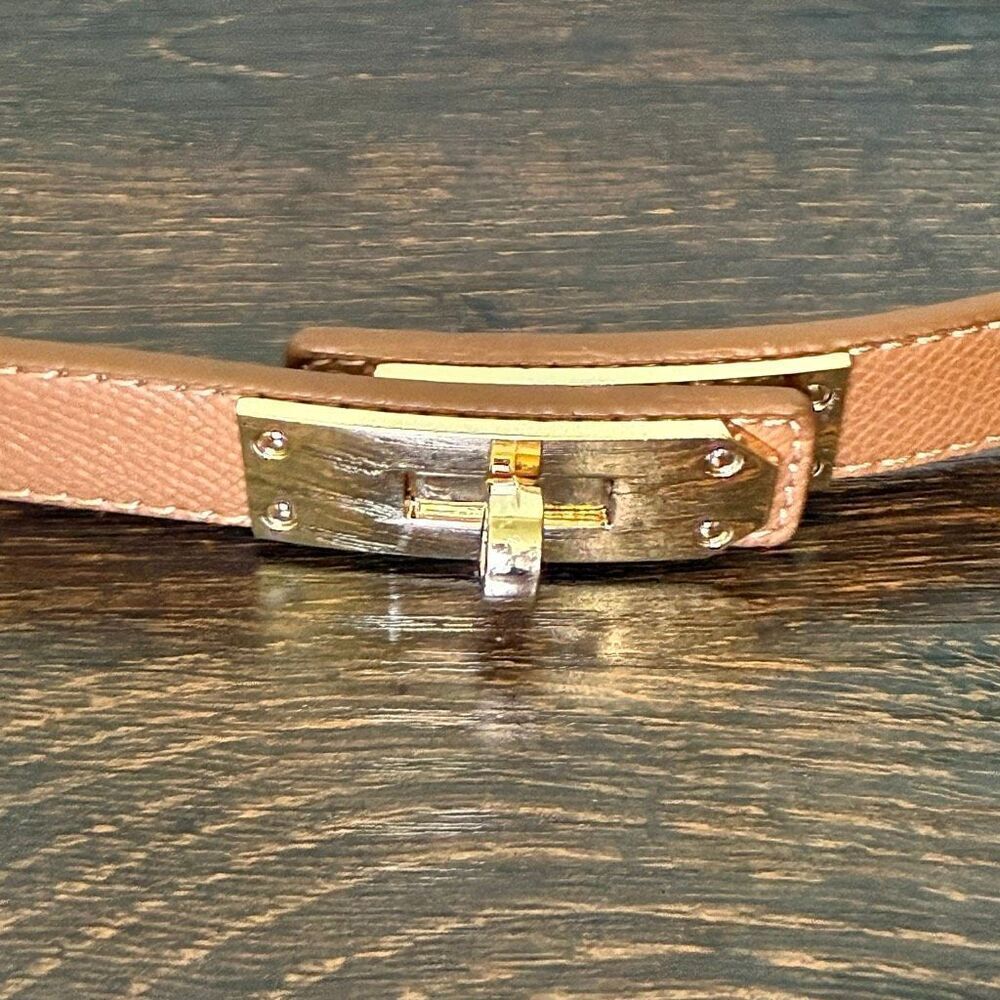 Women’s light brown gold slide adjustable Belt nwot size 19”-35” length and 3/4”